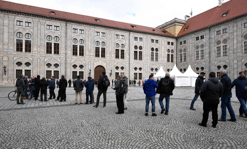 Journalists, staff and other attendees queue for Covid-19 tests in Munich on February 17. The conference takes place from February 18 to 20. AFP