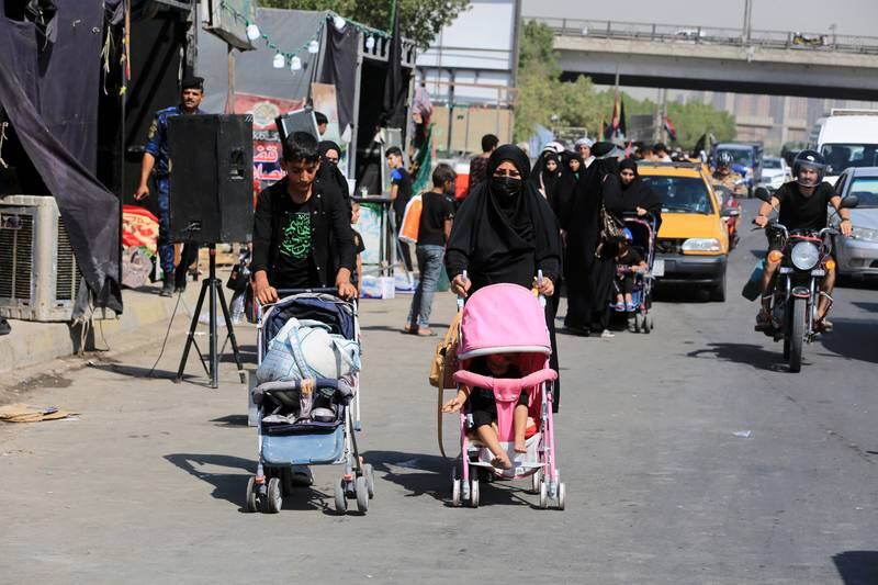 Iraqi Shiite pilgrims make their way to the tomb of Imam Hussain in Baghdad. EPA