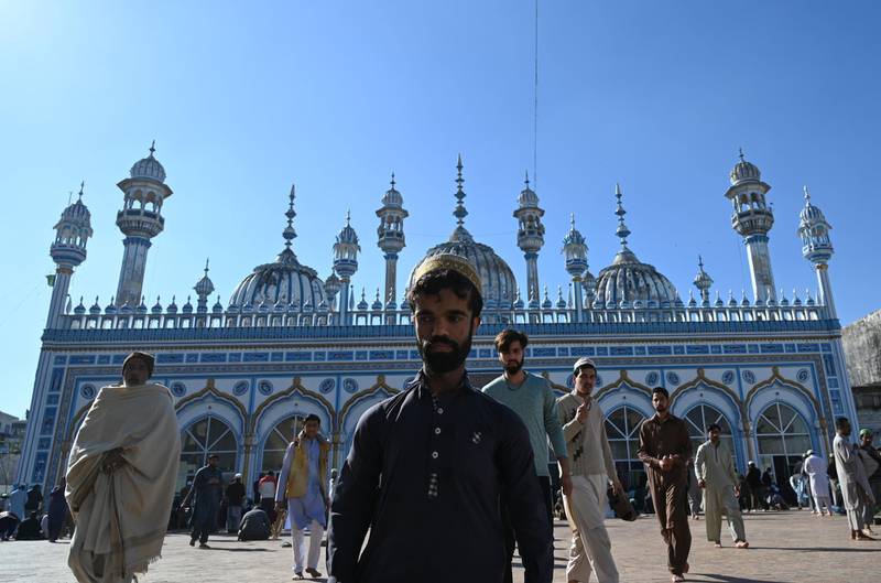 Rozi Khan leaves a mosque after Friday prayers in Rawalpindi. AFP