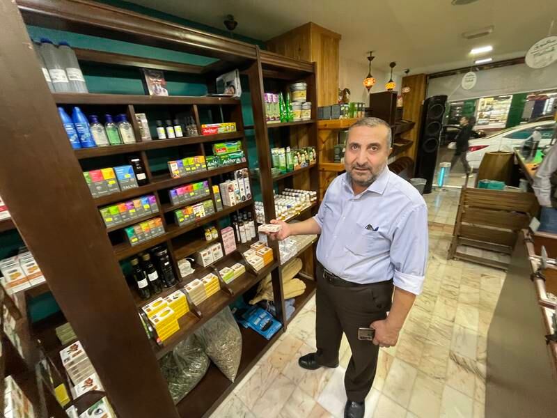 Jordanian wholesale merchant Amer Abu Al Samen at a spice shop in Amman that buys Aleppo and other soaps from him. The National