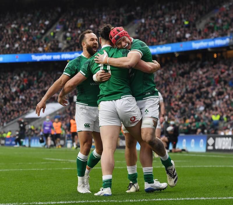 Ireland players celebrate after James Lowe (C) scored their first try. EPA