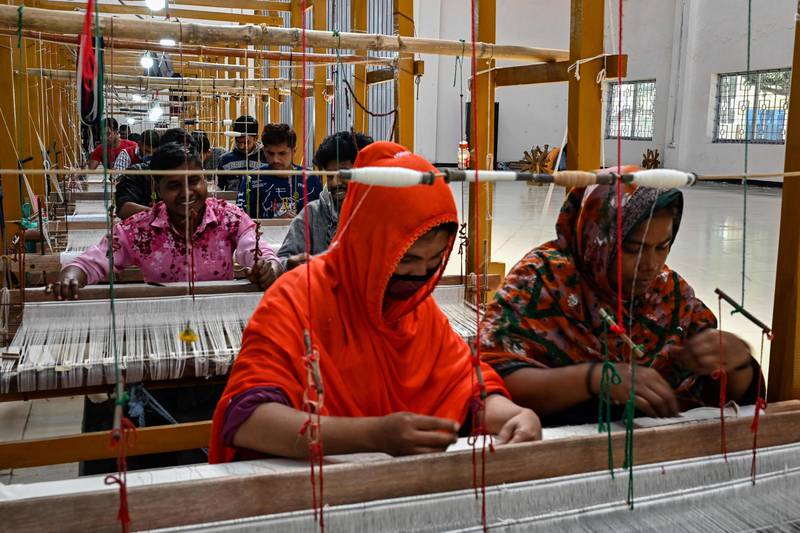 Weavers making clothing at the Dhakai Muslin Project facility in Narayanganj, Bangladesh. The country’s ready-made garment exports to a steadily growing global market now stand at more than $35 billion a year. AFP
