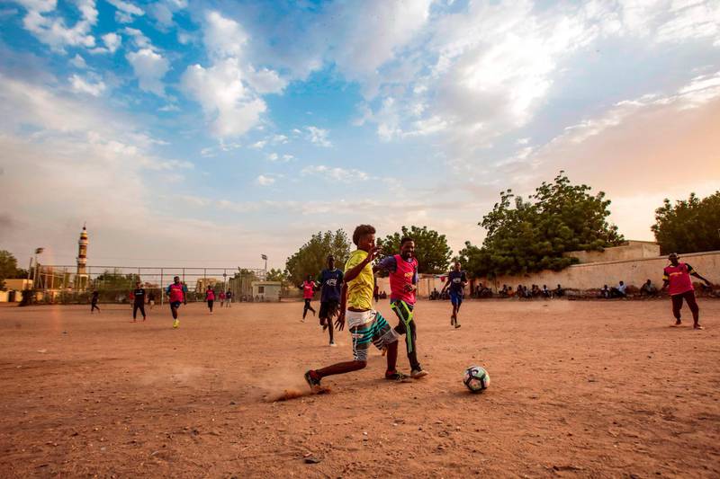 Sudanese youths play football on a dirt field in the capital Khartoum on July 28, 2019. All pictures AFP