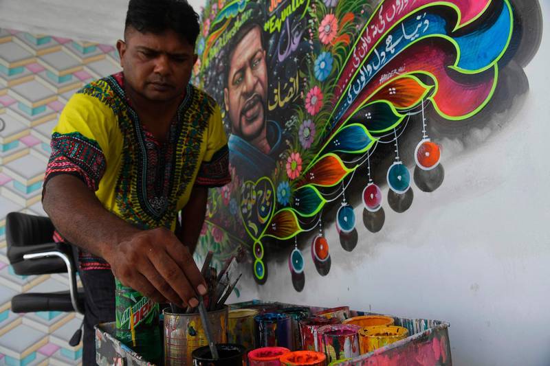 Haider Ali has depicted George Floyd surrounded by a colourful heart-shaped garland of flowers, with slogans such as #Black Lives Matter on one side and #justice and #equality on the other. AFP