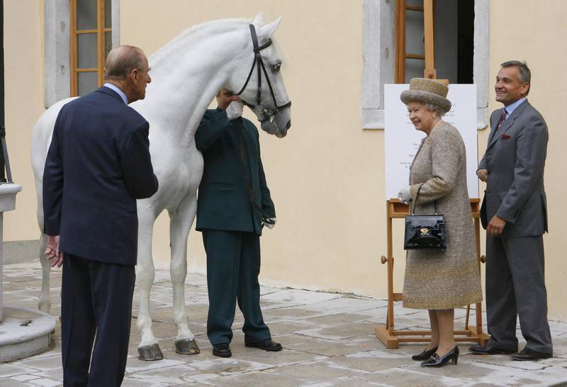 Queen Elizabeth and the Duke of Edinburgh, left, with a Lippizaner at the stables of the Lipica Stud during their state visit to Slovenia in January 2008. PA