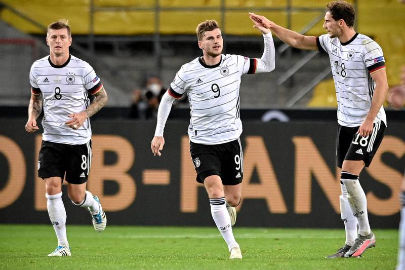 Germany's Timo Werner, centre, celebrates after scoring their opening goal against Switzerland. EPA