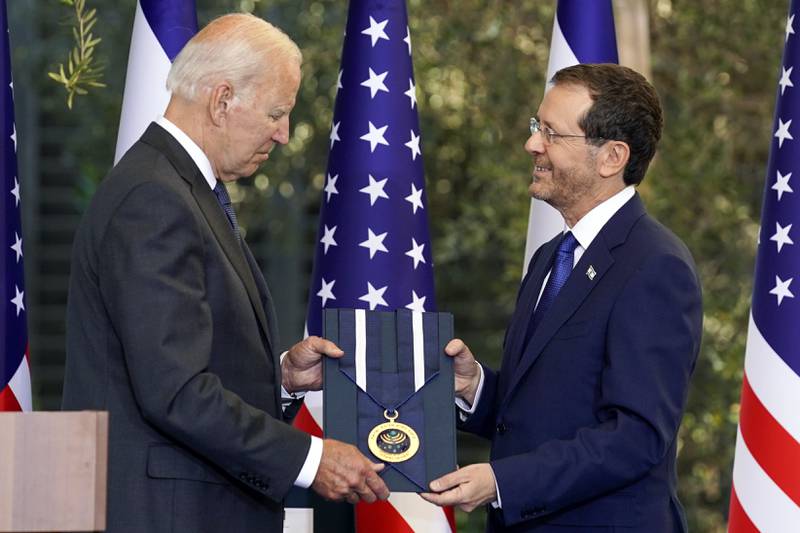 US President Joe Biden receives the Israeli Presidential Medal of Honour from Israeli President Isaac Herzog in Jerusalem. AP Photo