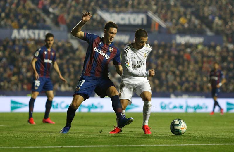 Eden Hazard of Real Madrid is challenged by Nikola Vukcevic of Levante. Getty Images