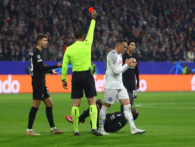 Eintracht Frankfurt's Randal Kolo Muani is shown a red card by referee Artur Soares Dias. Reuters