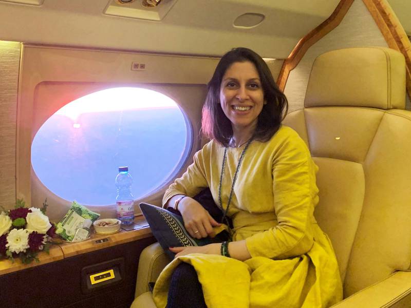 Mrs Zaghari-Ratcliffe on the plane en route to London after leaving Tehran, in March. Reuters
