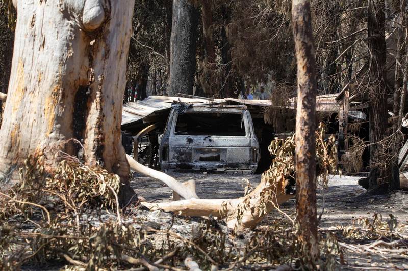 Damage caused by bushfire is seen at resident Brian Williams' resort at Lake Cooroibah Road in Noosa Shire, Queensland, Australia. AP Images