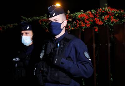 Police officers secure the attack site in the Paris suburb of Conflans St Honorine. Reuters