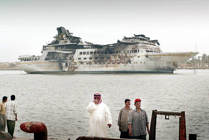 Al Mansur lists precariously in 2003 after it was bombed during the war