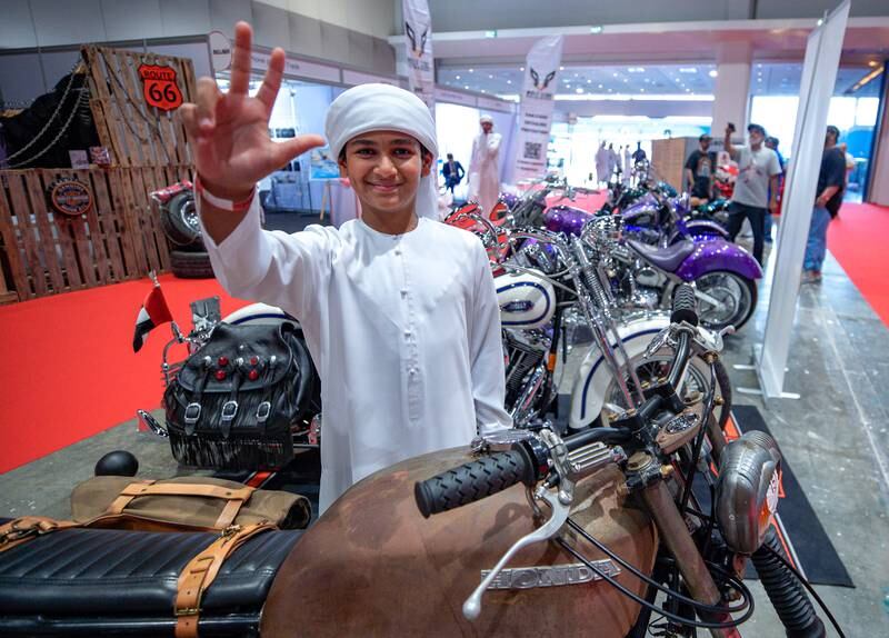 A young Emirati bike fan shows his appreciation.