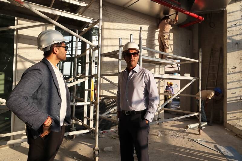 Trustee Raju Shroff, right, and Raghav Arora, director of a contracting company, take a look at the work inside the Hindu shrine being built in Dubai's Jebel Ali area. Pawan Singh/The National