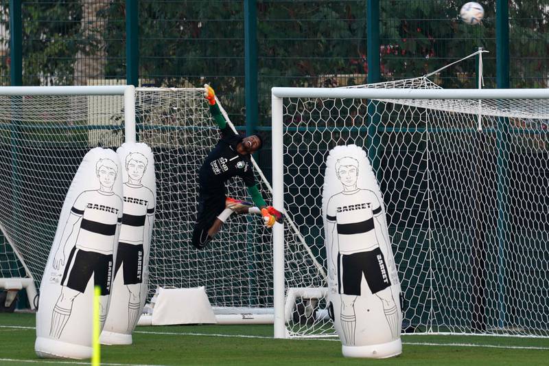 Saudi Arabia goalkeeper Mohammed Al-Yami makes an acrobatic save during a training session. AFP