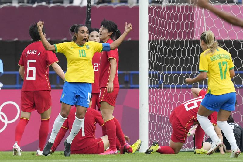 Brazil's Marta celebrates scoring the opening goal that saw her become the first woman footballer to score in five consecutive Olympic Games.