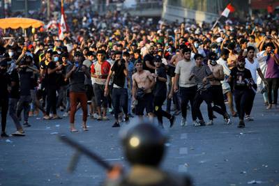 Demonstrators face security forces during an anti-government protest in Baghdad, Iraq. Reuters