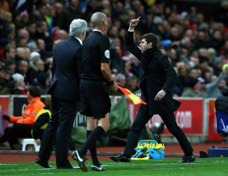 Tottenham Hotspur manager Mauricio Pochettino, right, celebrates during his side’s match against Stoke. Nigel Roddis / EPA