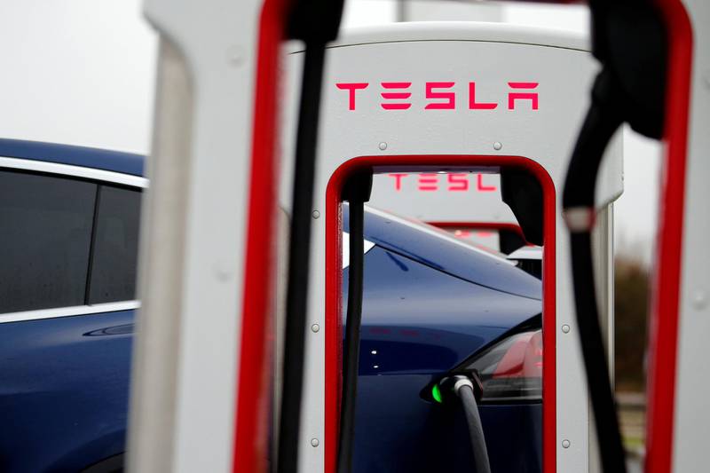 A driver recharges the battery of his Tesla car at a Tesla Super Charging station in a petrol station on the highway in Sailly-Flibeaucourt, France,  January 12, 2019. REUTERS/Pascal Rossignol