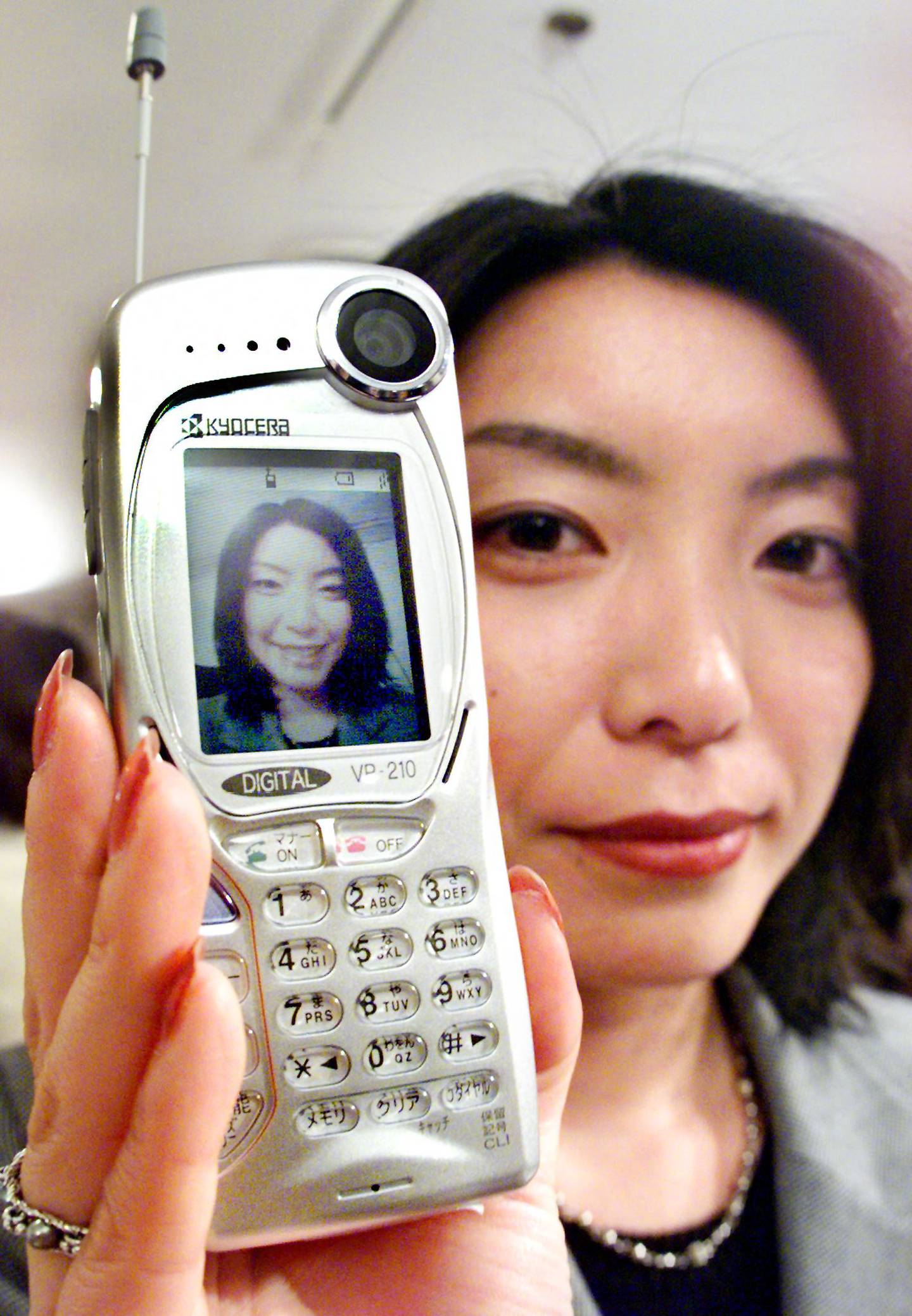 The Kyocera VP-210 had a front camera and can transmit two images per second through a mobile phone line. AFP