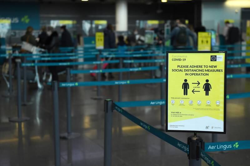 A sign to maintain social distance is seen at Dublin Airport Terminal 2, as the spread of the coronavirus disease. Reuters