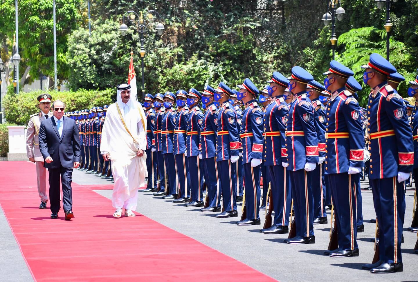 Egyptian President Abdel Fattah El Sisi accompanies Emir of Qatar Sheikh Tamim bin Hamad Al Thani past a guard of honour during the official welcoming ceremony at the Presidential Palace in Cairo, Egypt. EPA