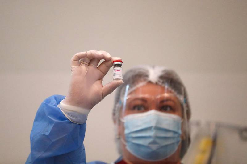 A health worker looks at the AstraZeneca vaccine in Tbilisi, Georgia. A shipment of 43,200 doses of AstraZeneca vaccine arrived in Georgia on 13 March as some countries temporarily halted the use of the jab. EPA