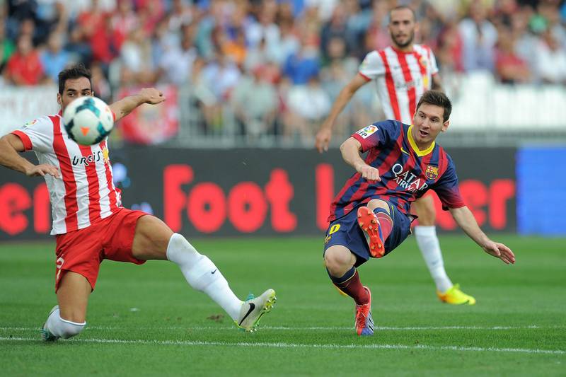 ALMERIA, SPAIN - SEPTEMBER 28:  Lionel Messi scores FC Barcelona's opening goal during the La Liga match between UD Almeria and FC Barcelona on September 28, 2013 in Almeria, Spain.  (Photo by Denis Doyle/Getty Images)