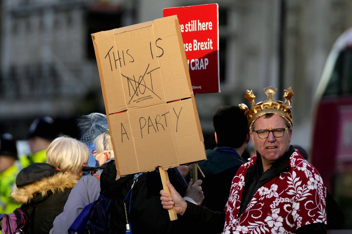 Protesters against 'partygate' in Parliament Square, central London, as Boris Johnson attends the weekly Prime Minister's Questions session. AP Photo