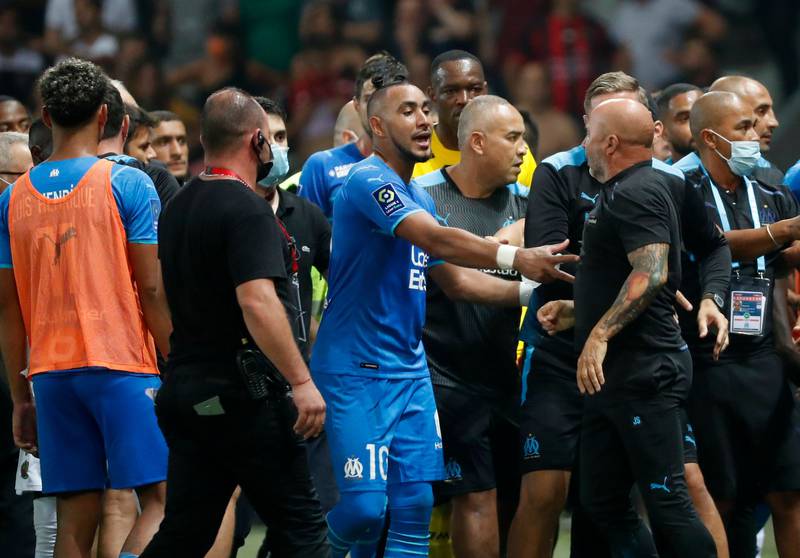 Marseille's Dimitri Payet reacts as the game is halted. Reuters