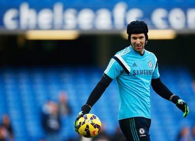 Chelsea goalkeeper Petr Cech warms up prior to their Premier League victory over Hull City on Saturday at Stamford Bridge. Clive Rose / Getty Images / December 13, 2014