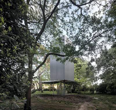Through another grove of trees, is a chapel designed and constructed by Sean Godsell of Melbourne Australia. Atop a metal altar, Godsell placed an empty upright metal rectangle with the dimensions of a shipping container.