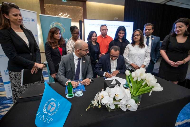 A pledge is signed as part of the UN Environmental Programme’s Recipe of Change campaign in Dubai. Ruel Pableo for The National