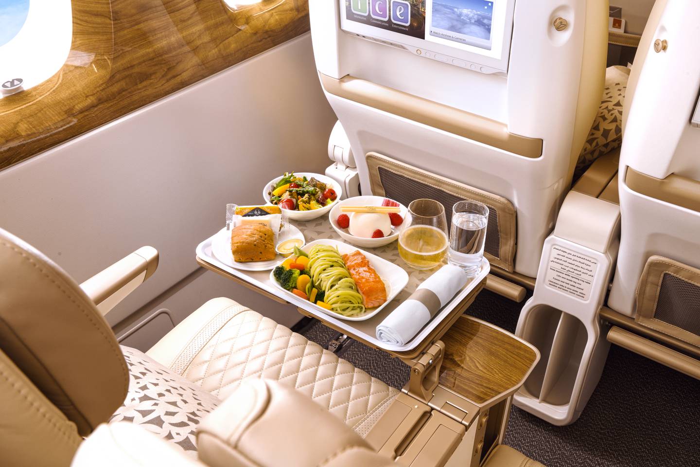 Travellers flying premium economy get a welcome drink on arrival, wider seats with extra legroom and an eight-inch recline. Photo: Emirates