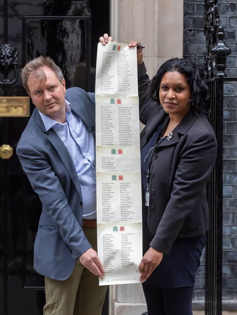 Richard Ratcliffe, left, and MP Janet Daby arrive in Downing Street to deliver a petition calling on Prime Minister Boris Johnson to work for Nazanin Zaghari-Ratcliffe's freedom. EPA