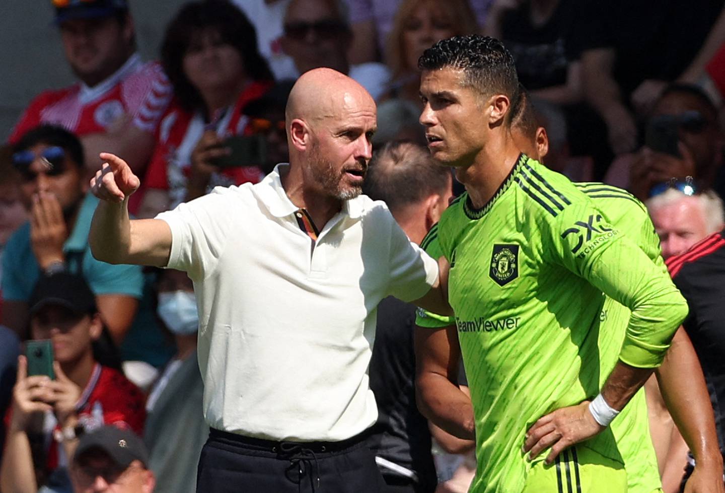 Manchester United manager Erik ten Hag speaks to Cristiano Ronaldo before his introduction as substitute against Southampton. AFP