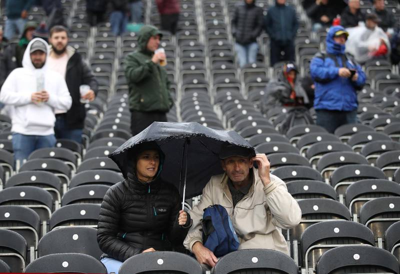 Spectators with umbrella's during a rain delay on Day 1 of the fourth Ashes Test between England and Australia at Old Trafford, Manchester. Reuters