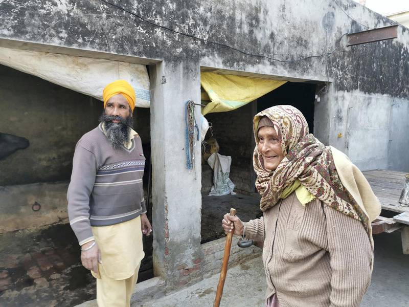 Gurmeet Kaur, 75, has been receiving help from neighbour and son’s namesake Balwinder Singh, 40. Neighbours and relatives have stepped in to help families of farmers who are at the protests. Taniya Dutta for The National