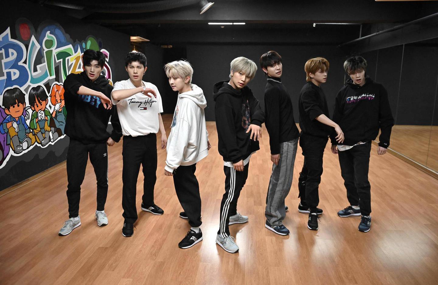 This picture taken on April 29, 2021 shows members of the K-pop boy band Blitzers performing during their dance practise session at a rehearsal studio in Seoul. Thirty teenagers, thousands of hours of training, dozens of shattered dreams: it all comes to a head next week when the Blitzers will be launched into the cut-throat K-pop market, hoping to become the next BTS. - TO GO WITH SKorea-music-social-entertainment-Kpop,FOCUS by Kang Jin-kyu
 / AFP / Jung Yeon-je / TO GO WITH SKorea-music-social-entertainment-Kpop,FOCUS by Kang Jin-kyu
