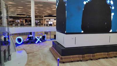 Travellers can play Playstation as they wait for flights at Bahrain's new airport terminal building. 
