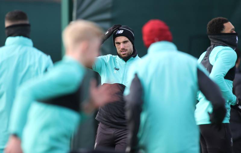 Liverpool's Jordan Henderson with teammates during training. Reuters
