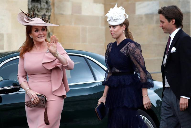 Sarah, Duchess of York, waves as she arrives with Princess Beatrice and Edoardo Mapelli Mozzi ahead of the wedding. Reuters