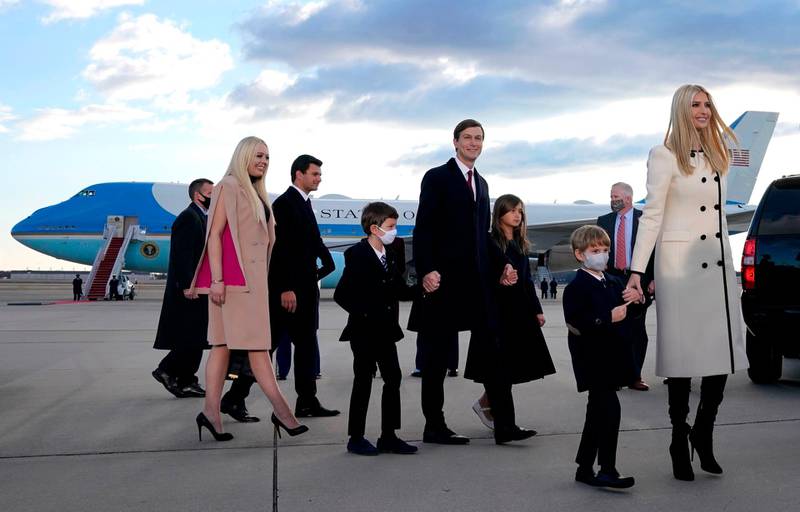 Ivanka Trump, right, husband Jared Kushner, centre, their children, Eric and Donald Jr., Tiffany Trump, left, and Trump family members stand on the tarmac at Joint Base Andrews in Maryland as they arrive for US President Donald Trump's departure. AFP