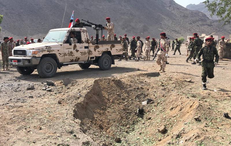Yemeni security forces rush to the scene of the missile attack. AFP