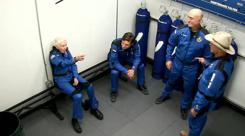 This still image taken from video by Blue Origin shows Funk, Daemen and the Bezos brothers before they leave for the flight.