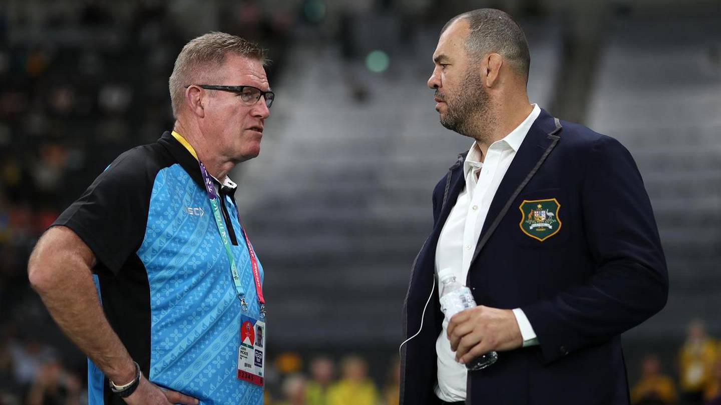 Fiji coach John McKee, left, talks with his Australian counterpart, Michael Cheika, ahead of their Rugby World Cup Pool D game on Saturday. Getty Images