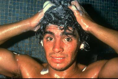 Nov 1980:  Portrait of Diego Maradona of Argentina washing his hair after a match. \ Mandatory Credit: Allsport UK /Allsport