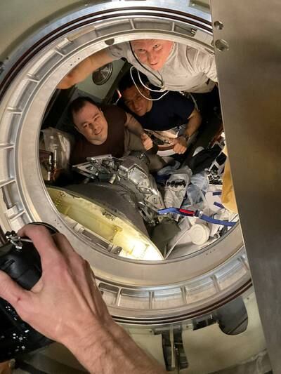 The three astronauts before undocking the space capsule to leave the ISS and return to Earth. Reuters