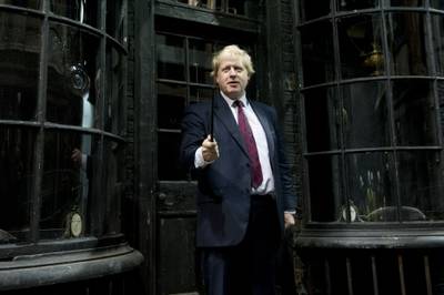 Mr Johnson gestures attends a Harry Potter studio tour of Diagon Alley, at the Warner Brother Studios, London, in December 2011. AP Photo